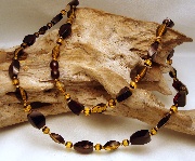 Necklace Fragments, Almonds and Faceted Globe Composition Long